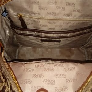 Micheal khors book bag and a swiss legend watch